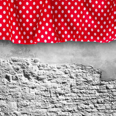 Stone wall texture with cloth. Red tablecloth white peas for recording menu, recipe. Product pages for installation recipe books menuの写真素材