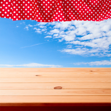 Pure notebook for recording menu, recipe on red checkered tablecloth tartan. Wooden table close up view from topの写真素材