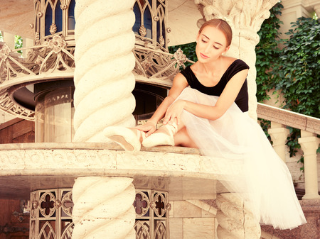 Beautiful young ballerina rehearsing. Actor dancer, ballet.  Marble interior.の写真素材