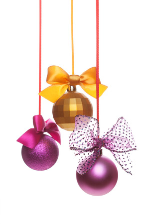 Christmas gold ball with bow isolated on white background.の写真素材