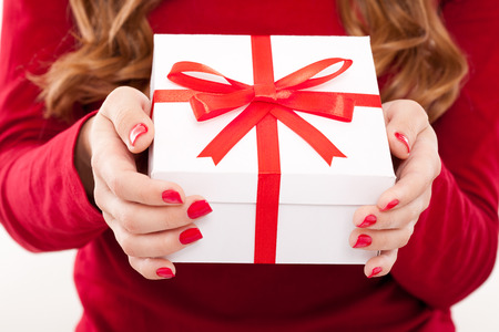 christmas woman with gift and red manicureの写真素材