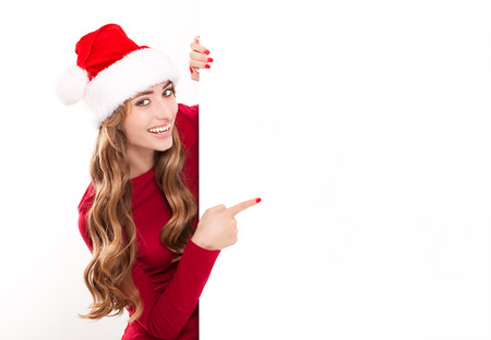 Santa girl showing your text on a billboardの写真素材