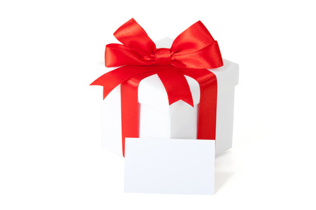 Single box with red ribbon and gift card on white backgrounの写真素材