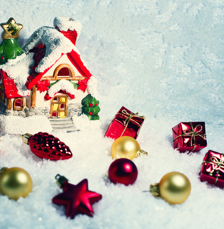 Christmas ornaments on Christmas tree. Christmas border with ornament, present and snowの写真素材