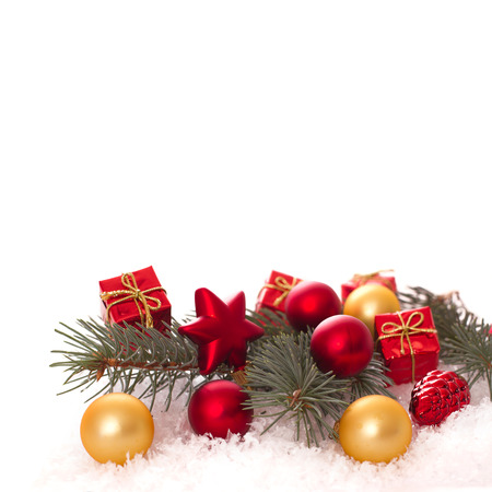 Christmas ornaments on Christmas tree. Christmas border with ornament, present and snowの写真素材