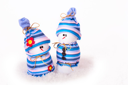 Christmas ornaments cheerful snowmen on Christmas tree. Christmas border with ornament, present and snowの写真素材