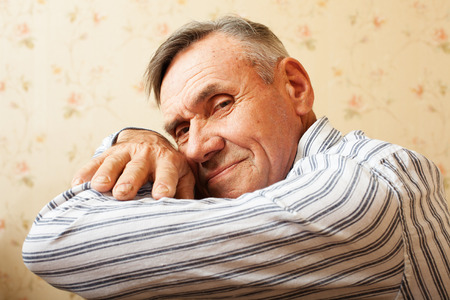 Portrait of senior man relaxing at home. Elderly man smiling and happyの写真素材