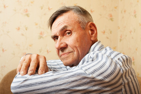 Portrait of senior man relaxing at home. Elderly man smiling and happyの写真素材