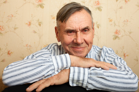 Portrait of senior man relaxing at home. Elderly man smiling and happyの写真素材