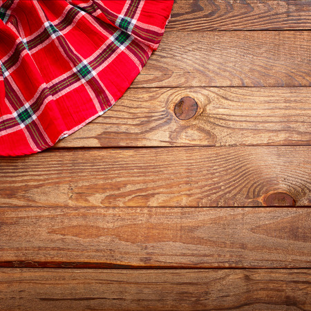 Wood texture, wooden table with red tablecloth tartan top view. Collage for menuの写真素材