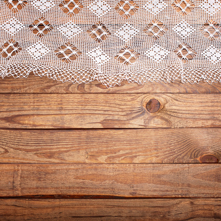 Wood texture, wooden table with white lace tablecloth top view. Collage for menuの写真素材