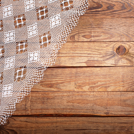 Wood texture, wooden table with white lace tablecloth top view. Collage for menuの写真素材