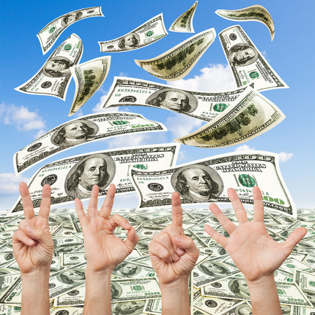 Happy new year with hands forming number 2015. Hand concept. Dollar bills backgroundの写真素材