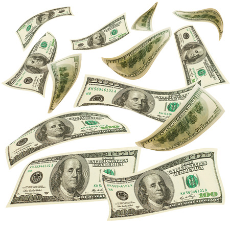 concept of financial success. flying banknotes on white backgroundの写真素材