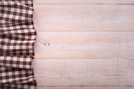 Top view of checkered tablecloth on white wooden table. Unique perspectivesの写真素材