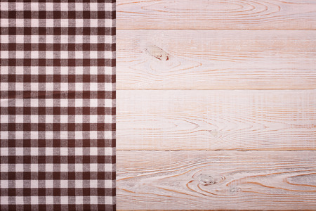 Top view of checkered tablecloth on white wooden table. Unique perspectivesの写真素材
