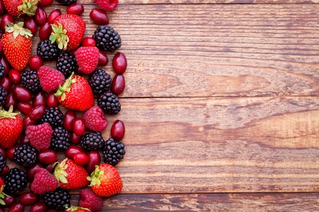 Berries summer fruit on wooden table. healthy lifestyle concept. horizontally.の写真素材