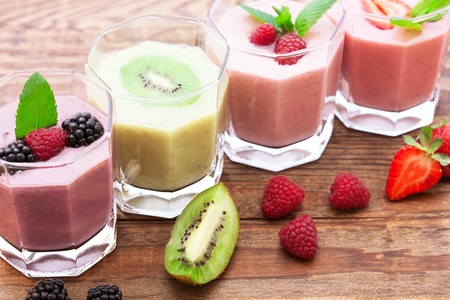 Drink smoothies summer strawberry, blackberry, raspberry on wooden table.の写真素材
