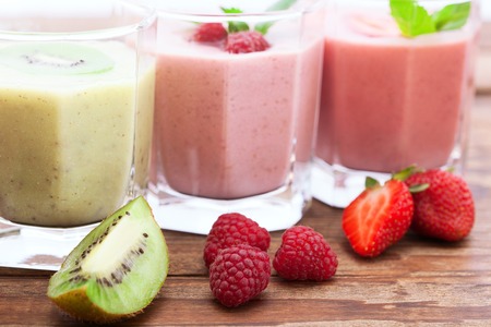 Drink smoothies summer strawberry, blackberry, raspberry on wooden table.の写真素材