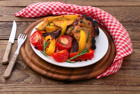 Lunch cooked meat barbeque with vegetables and spicesの写真素材