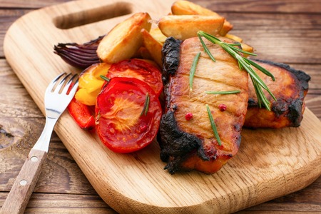 Lunch cooked meat barbeque with vegetables and spicesの写真素材