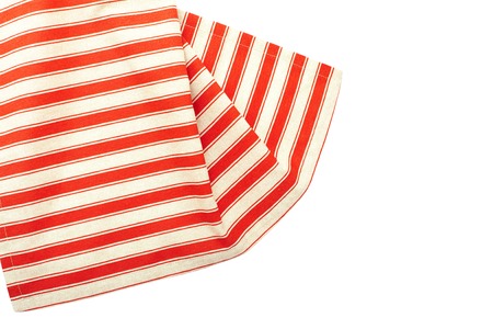 Tablecloth made of linen with red stripes for the dish on a white background isolatedの写真素材
