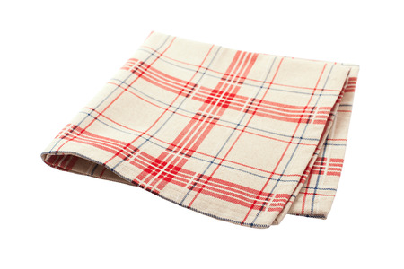 Linen tablecloth in red checkered for  dish on a white background isolatedの写真素材