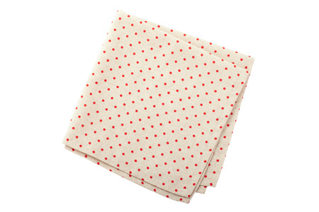 Linen tablecloth with red dots for food on a white background isolatedの写真素材