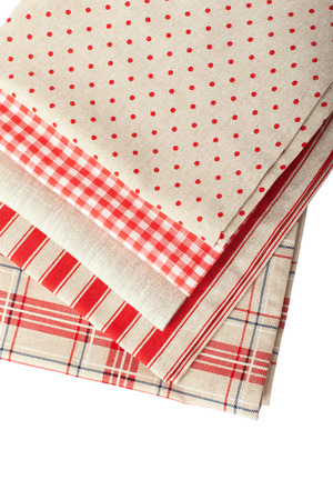 Stack of colorful dish towels isolated on whiteの写真素材