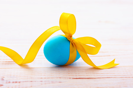 Easter eggs on wooden background. Holiday background.の写真素材