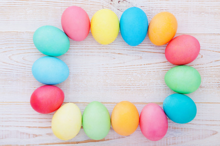 Easter eggs on wooden background. Holiday background.の写真素材