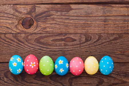 Easter eggs on wooden background. Holiday background.の写真素材