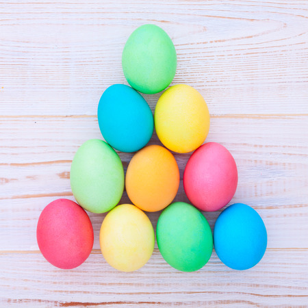 Easter eggs on wooden background. Holiday background.の写真素材