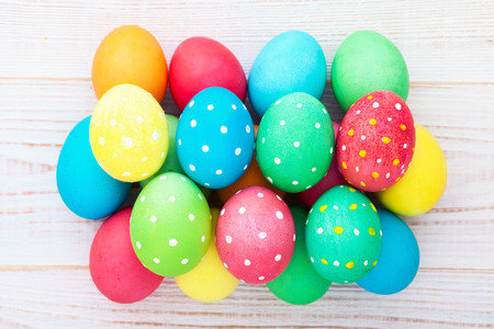 Easter eggs in basket with spring flowersの写真素材