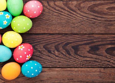 Easter eggs in basket with spring flowersの写真素材