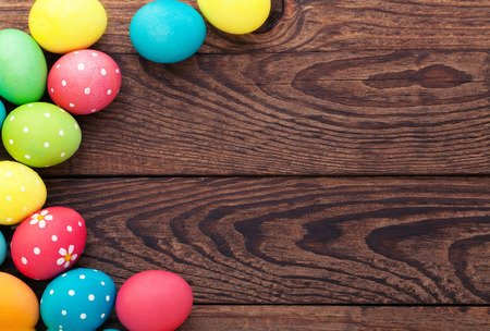 Easter eggs in basket with spring flowersの写真素材