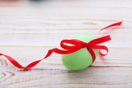 Easter eggs in basket with spring flowersの写真素材