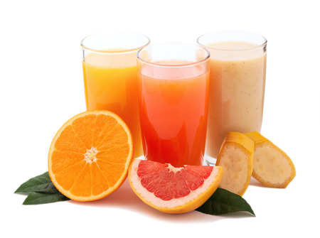 Tropical fruits and juice isolated on white backgroundの写真素材