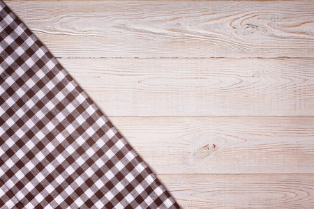 Tablecloth tartan on white wooden table. Flat mock up for design. Top view.の写真素材