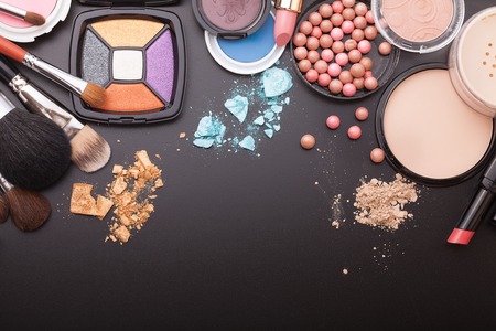 Various makeup products on dark background with copyspaceの写真素材