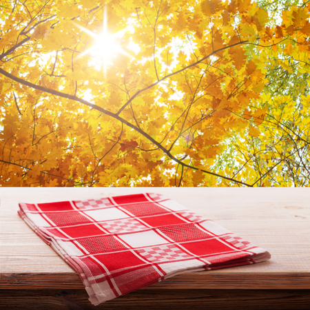 Empty table and tablecloth, Autumn background, for product display montage. Mock up for designの写真素材