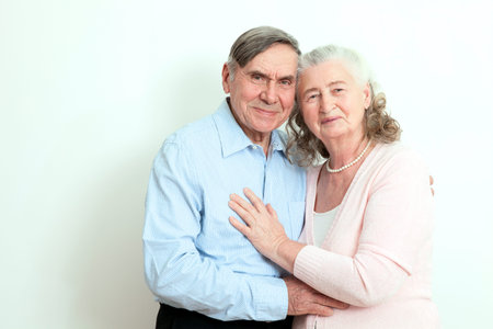 Portrait of candid senior couple enjoying their retirement. Affectionate elderly couple with...