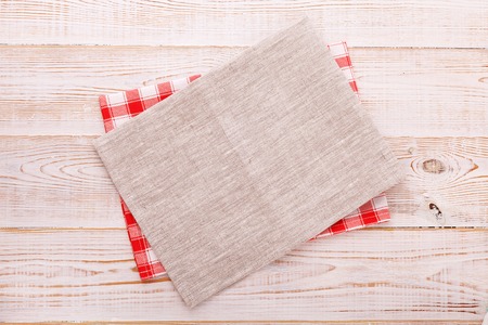 Napkin. Cloth napkin on white wooden background. Top view, mock up.の写真素材
