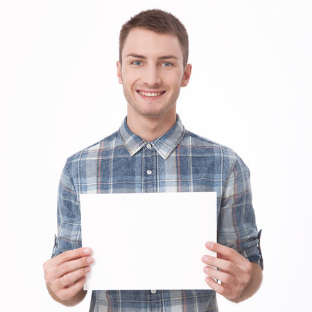 Young man holding blank form close-up on a white background.の写真素材