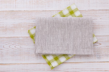 Napkin. Cloth napkin on white wooden background. Top view, mockup.の写真素材