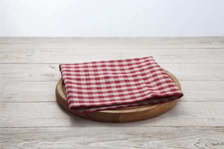 Napkin. Stack of colorful dish towels on white wooden table background top viewの写真素材