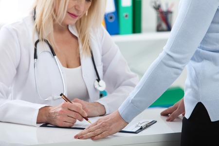 Healthcare and medical concept - doctor with patient in hospitalの写真素材