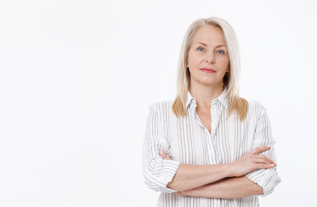 Friendly smiling middle-aged business woman isolated on white backgroundの写真素材