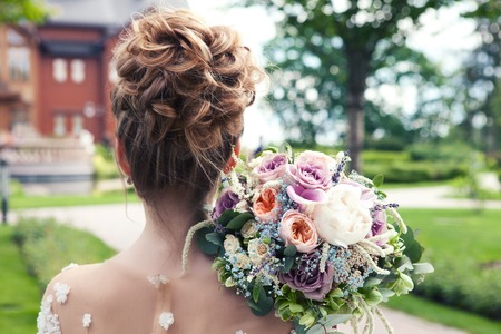 Bride holds a wedding bouquet, wedding dress , wedding details. Wedding ceremony concept.の写真素材