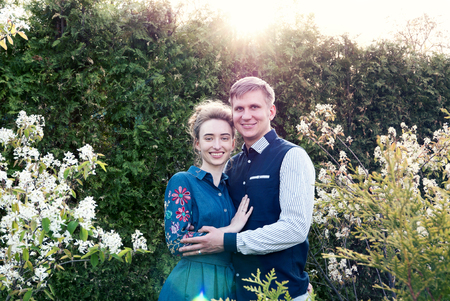 Bride and groom in a park. Kissing couple newlyweds bride and groom at wedding in nature green forest are kissing photo portrait.Wedding Couple Wedding ceremony concept.の写真素材